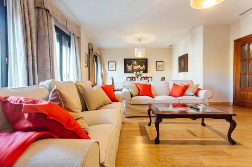 a living room with two couches and a coffee table at Duplex with terrace- 5Bd 3Bth- Center in Seville
