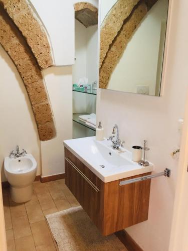 a bathroom with a sink and a toilet at B&B La Casa Di Tufo in Orvieto