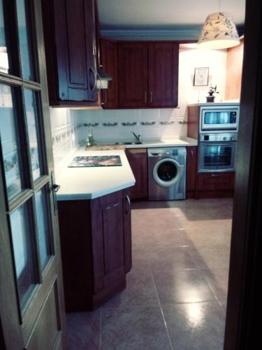 Una cocina o zona de cocina en Alondra
