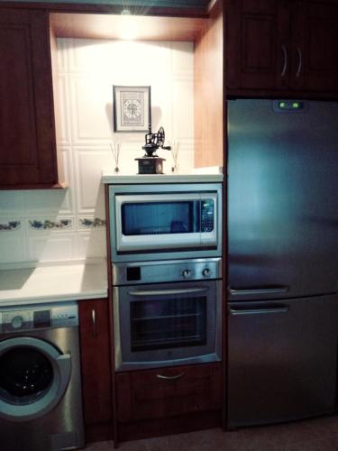 Una cocina o zona de cocina en Alondra