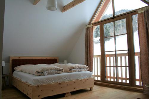 Postel nebo postele na pokoji v ubytování Klösterle Haus Resi