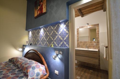 Krevet ili kreveti u jedinici u okviru objekta Centro Sicilia Rooms-Suites & Terrace