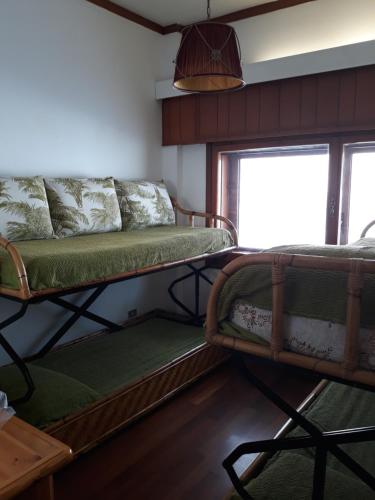 a room with two bunk beds and a couch at Villa Aremogna in Roccaraso