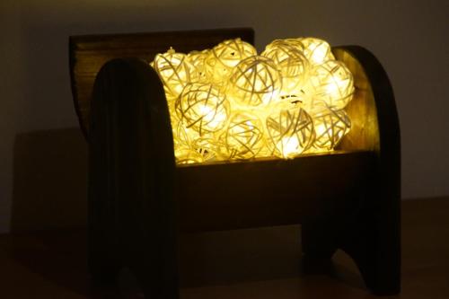 a chair in the dark with a pile of lights at El Duende del Tejar in El Gastor