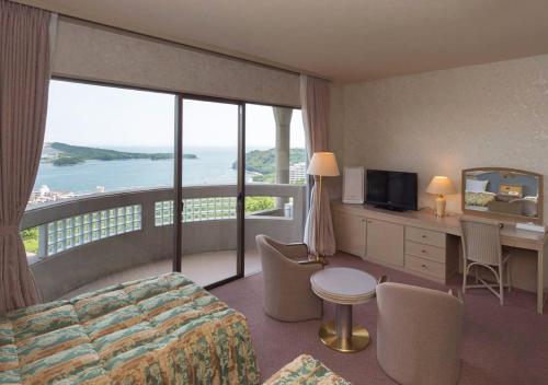 a hotel room with a view of the ocean at Izumigo Hotel Altia Toba in Toba