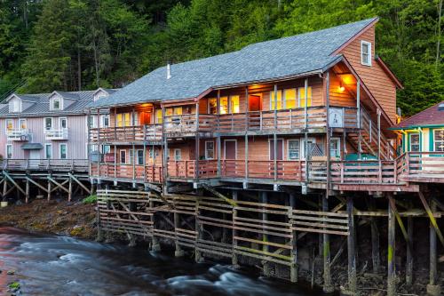a house on a wooden bridge over a river at Inn At Creek Street in Ketchikan