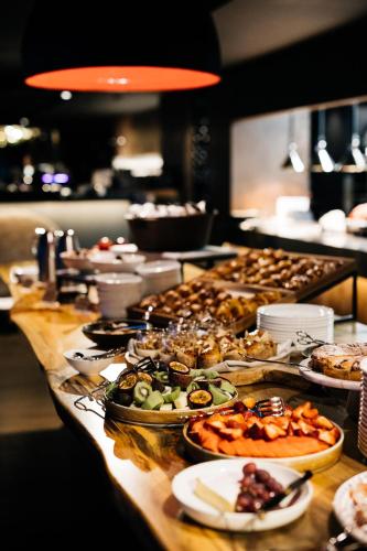 a buffet line with many different types of food at MACq 01 Hotel in Hobart