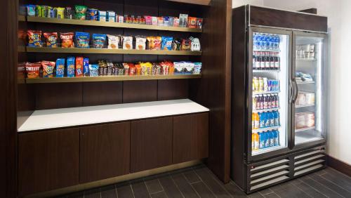 a refrigerator filled with lots of food in a store at Hyatt House Jersey City in Jersey City