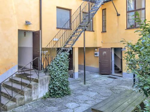a stairwell of a building with a green plant at Boende Visby in Visby