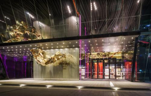 a building with a gold sculpture on the front of it at Hard Rock Hotel Shenzhen in Shenzhen