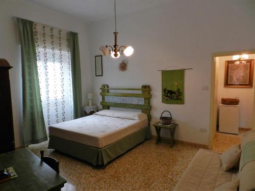 Ένα ή περισσότερα κρεβάτια σε δωμάτιο στο Casa Corte con Terrazza