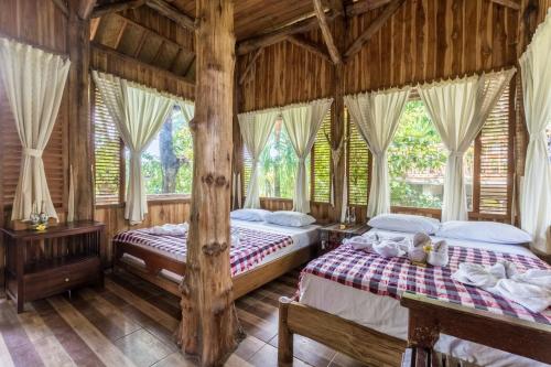 Postel nebo postele na pokoji v ubytování Omunity Bali