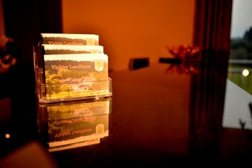 a stack of books sitting next to a door at Vichter Landhaus in Stolberg