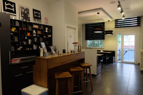 a kitchen with a counter and a bar in a room at My Home Garden in Istanbul