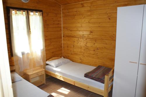 Postel nebo postele na pokoji v ubytování Camping Village Viareggio