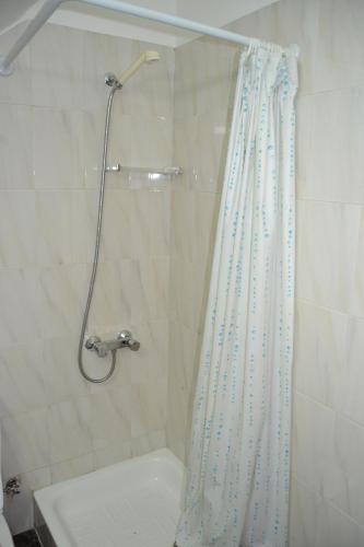 a bathroom with a shower with a shower curtain at Central Suite in Funchal 1N in Funchal