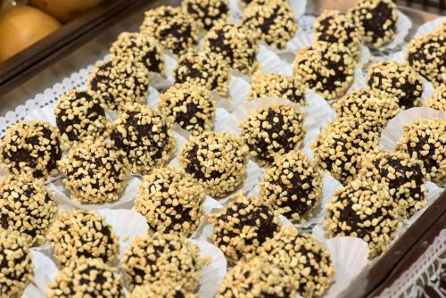 a tray of cookies with nuts on top of them at Hotel Barátság in Hajdúszoboszló