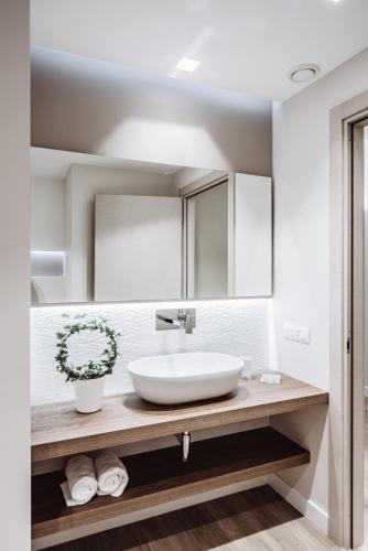 a bathroom with a sink and a mirror at Estella luxury suites in Turin