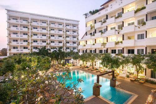 an image of a hotel with a swimming pool at Hill Fresco Hotel in Pattaya South