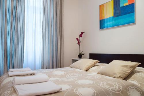 Postel nebo postele na pokoji v ubytování Modern Apartments Opatovická