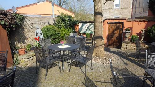 a table and chairs sitting on a patio at Gasthaus Krone in Wiesentheid