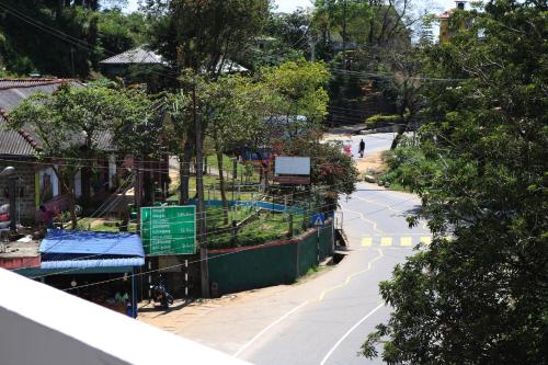 an empty street with a basketball court in a park at Queens rest inn in Haputale