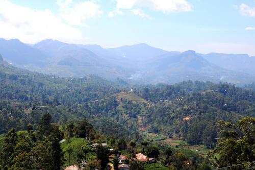 a view of a valley with mountains in the background at Queens rest inn in Haputale
