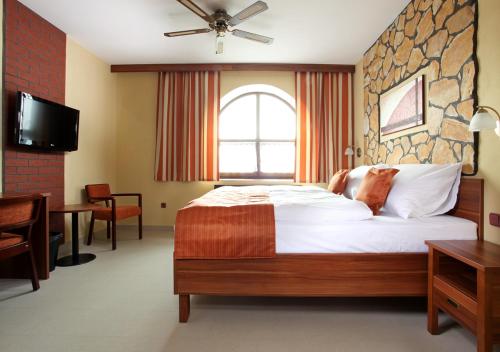 Postel nebo postele na pokoji v ubytování Hotel Vinopa