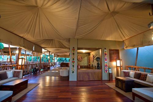 a large tent with tables and chairs in a room at Neptune Mara Rianta Luxury Camp - All Inclusive. in Masai Mara