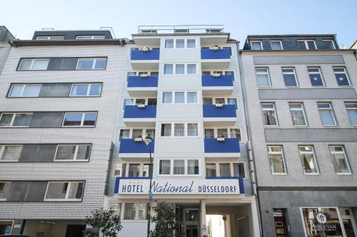 a building with a sign on the front of it at Hotel National Düsseldorf (Superior) in Düsseldorf