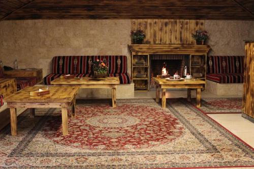 a living room with two couches and a fireplace at Reston Hotel in Jounieh