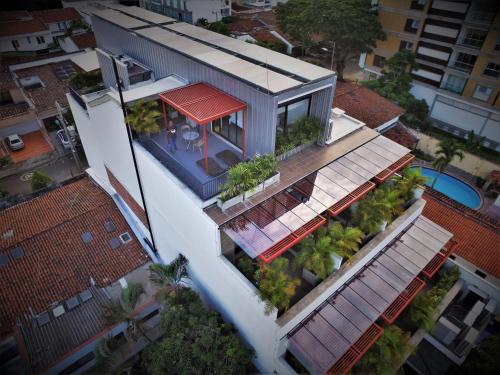 an overhead view of a house with a red roof at Alko Hotel Integrado in Cali