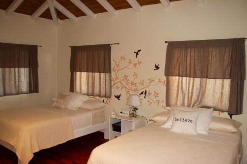 Postel nebo postele na pokoji v ubytování Cabañas La Casa de Pucha