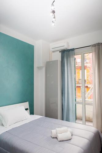 a bedroom with a bed with two towels on it at Foresteria Boccadasse in Genova
