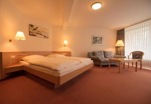 Ένα ή περισσότερα κρεβάτια σε δωμάτιο στο Winzergarten Hotel-Restaurant