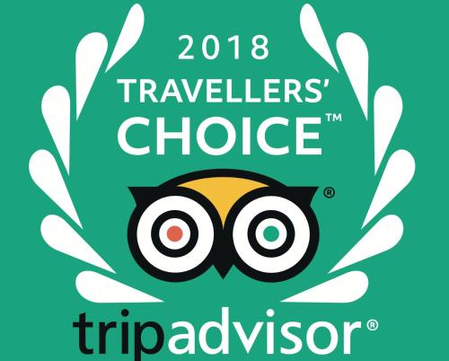 a poster for the travellers choice triadposium with an owl at Aranjuez Hotel & Suites in David