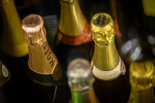 a group of wine bottles lined up next to each other at Eco Rooms&Breakfast Tirano in Tirano
