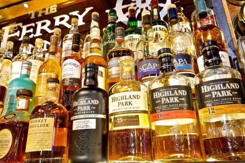 a display of different types of bottles of alcohol at Ferry Inn in Stromness