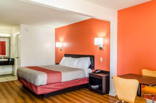 a hotel room with a bed and a desk at Motel 6-Saraland, AL in Saraland