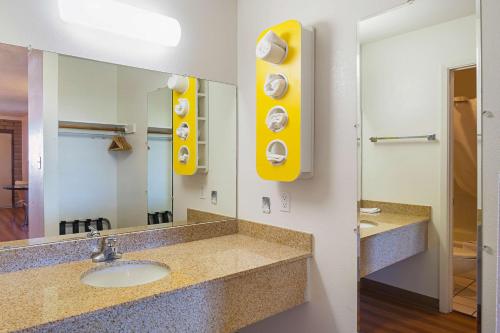 a bathroom with a sink and a mirror at Motel 6-Safford, AZ in Safford