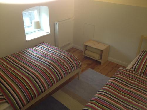 a small bedroom with a bed and a window at Apartment Villa Elisa in Bad Kreuznach