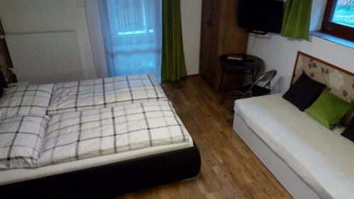 Ένα ή περισσότερα κρεβάτια σε δωμάτιο στο Apartmány Sharka -Šárka Justrová