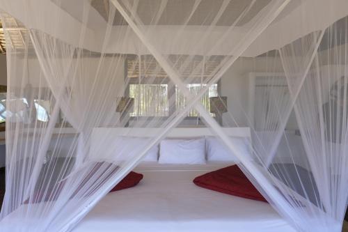 Katil atau katil-katil dalam bilik di Jua Retreat Adults Only