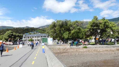 a group of people walking down a street at Akaroa Vista in Akaroa