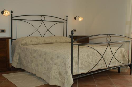 Ένα ή περισσότερα κρεβάτια σε δωμάτιο στο B&B Il Girasole - Rooms & House in country - air conditioned - 1500 meters from historic center