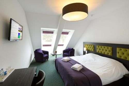 Ліжко або ліжка в номері Hotel restaurant Nederheide
