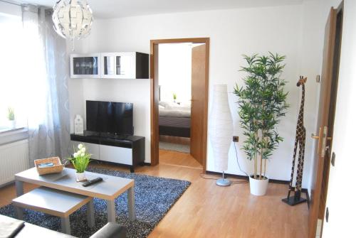 Televisyen dan/atau pusat hiburan di Apartment Unna-Massen mit eigener Sauna