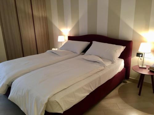 Ένα ή περισσότερα κρεβάτια σε δωμάτιο στο apartment Zagara - Gardone Riviera center