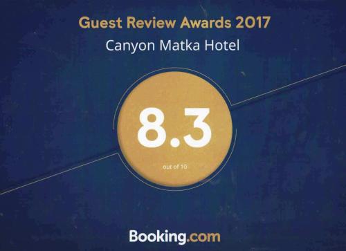 a sign that reads guest review awards cancoon makeka hotel at Canyon Matka Hotel in Matka
