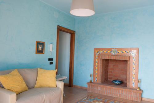 a living room with a couch and a fireplace at La Residenza di Carolina in Cassino